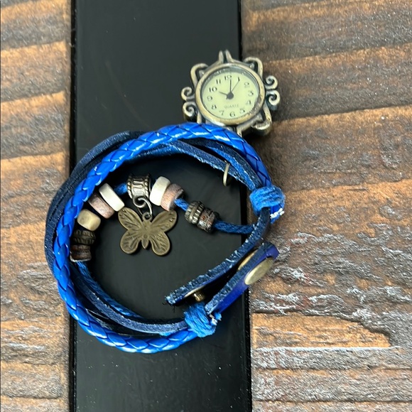 Blue Braided Leather Bracelet with Watch, Beads, and Butterfly Charm Well-loved - Picture 1 of 4